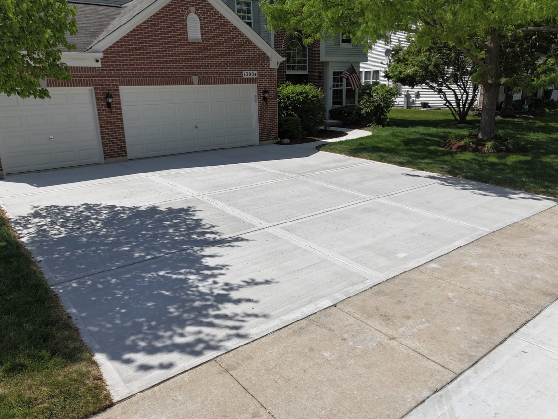Decorative stamped concrete patio with custom pattern and warm earth-tone staining